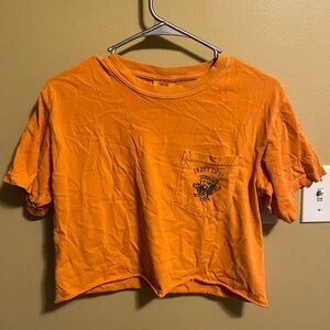 Orange cropped Alpha Chi Omega Halloween Derby Days graphic tee